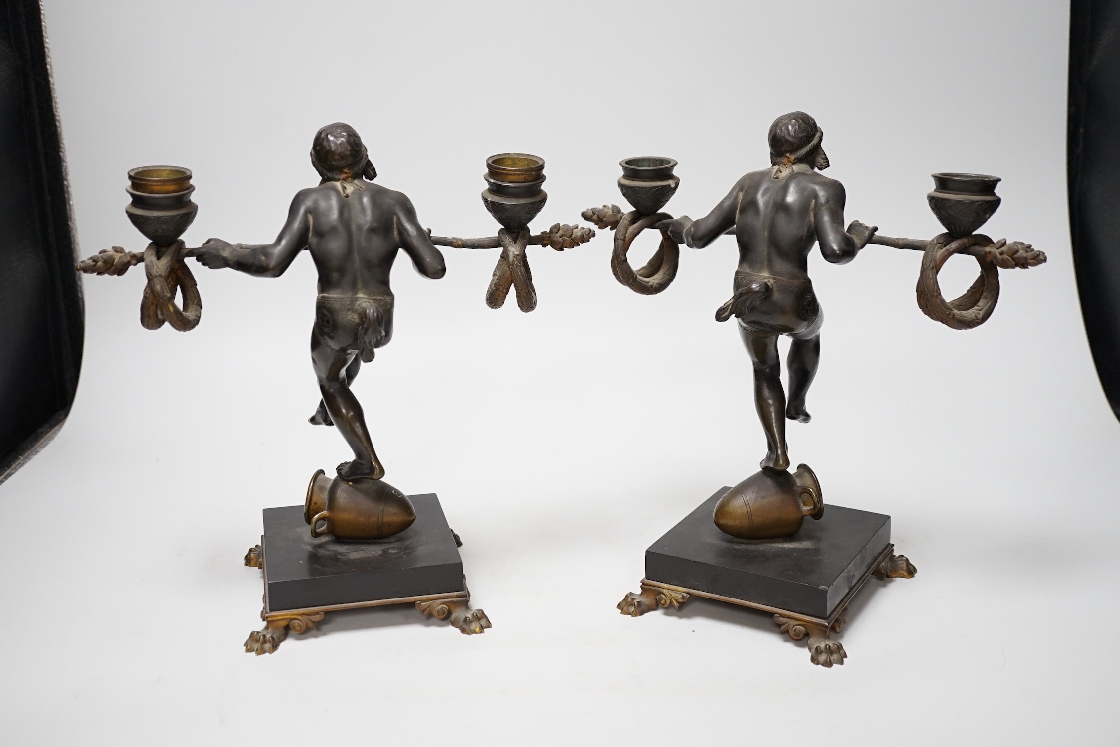 Eugene Cartier (1861-1943). A pair of bronze ‘acrobat’ candelabra, 24cm